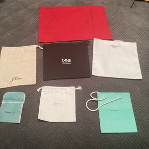Seven various size dust bags, paper bags, Tiffany & Co. Small Pouch, etc. 551